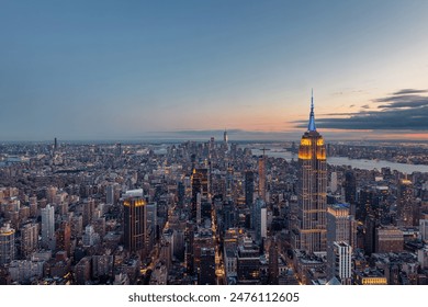 Aerial view of the Empire State Building and downtown Manhattan at dusk, New York City.  - Powered by Shutterstock