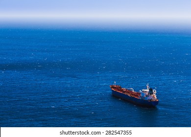 Aerial View To Empty Container Cargo Ship In The Blue Ocean