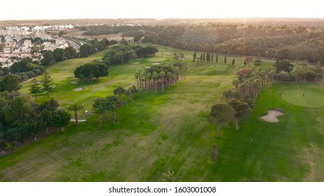 Aerial view. Empty golf course. Breathtaking sunset shining on golf course. - Shutterstock ID 1603001008