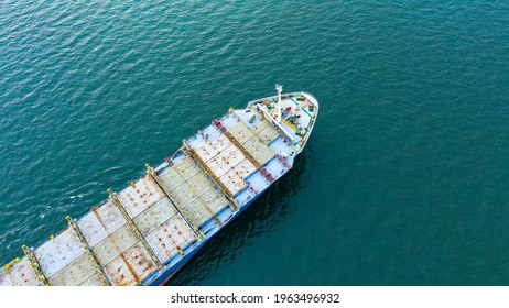 Aerial view of empty international containers cargo ship at industrial import-export port transport goods around world, global transportation and logistic business.Oversea international Business.