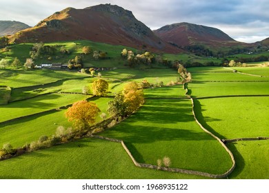 Aerial view of endless lush pastures and farmlands of England. Beautiful English countryside with emerald green fields and meadows. Rural landscape on sunset. - Powered by Shutterstock