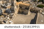 Aerial view of the entrance of cathedral of Lecce, in Apulia, Italy. The metropolitan cathedral of Santa Maria Assunta, called Duomo, is located in homonymous square in the historic center of the city