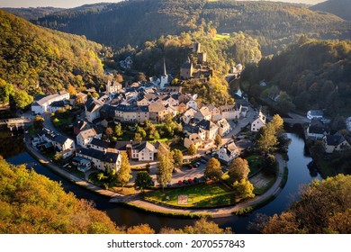 Aerial view of Esch-sur-Sure, medieval town in Luxembourg, dominated by castle, canton Wiltz in Diekirch. Forests of Upper-Sure Nature Park, meander of winding river Sauer, near Upper Sauer Lake. - Shutterstock ID 2070557843