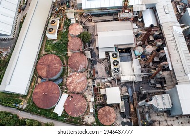 Aerial View Of Ethanol Industrial Or Biofuel Refinery Processing Factory With Smoke From Chimney, Storage Tanks And Warehouse. Problem Of Pollution Climate And Global Warming