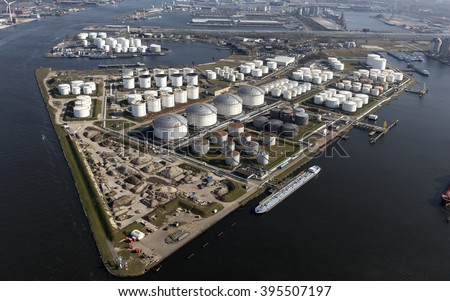 Aerial view of the Eurotank terminal with lots of white oil storage tanks in the harbour of Amsterdam.