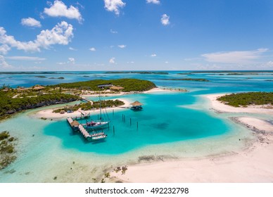 Aerial view exotic island and authentic buildings   pier for yachts 