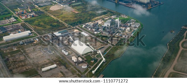 Aerial view of factories in industrial\
district. Property, land and real estate\
business.