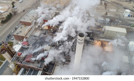 Aerial View Of A Factory And A Smoke Stack