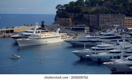 Aerial View Of The Famous City On The Mediterranean Sea Luxury Yacht Moored In The Bay, Marina Port, Yacht Club. Panorama Of The European Landscape From Above MONTE CARLO, MONACO SEPTEMBER 2021 