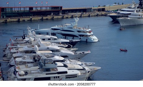 Aerial View Of The Famous City On The Mediterranean Sea Luxury Yacht Moored In The Bay, Marina Port, Yacht Club. Panorama Of The European Landscape From Above MONTE CARLO, MONACO SEPTEMBER 2021 