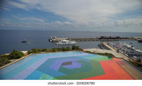 Aerial View Of The Famous City On The Mediterranean Sea Luxury Yacht Moored In The Bay, Marina Port, Yacht Club. Panorama Of The European Landscape From Above MONTE CARLO, MONACO SEPTEMBER 2021 