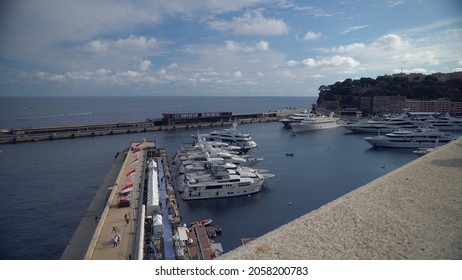 Aerial View Of The Famous City On The Mediterranean Sea Luxury Yacht Moored In The Bay, Marina Port, Yacht Club. Panorama Of The European Landscape From Above MONTE CARLO, MONACO SEPTEMBER 2021 