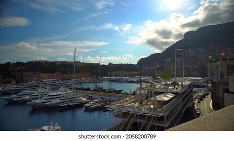 Aerial View Of The Famous City On The Mediterranean Sea Luxury Yacht Moored In The Bay, Marina Port, Yacht Club. Panorama Of The European Landscape From Above MONTE CARLO, MONACO SEPTEMBER 2021 