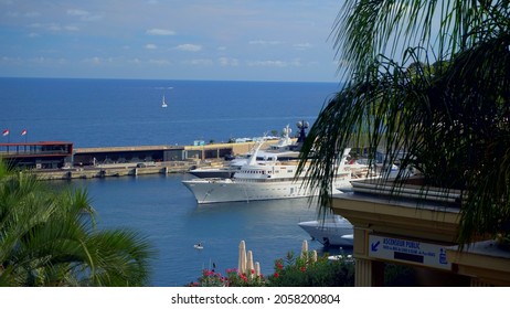 Aerial View Of The Famous City On The Mediterranean Sea Luxury Yacht Moored In The Bay, Marina Port, Yacht Club. Panorama Of The European Landscape From Above MONTE CARLO, MONACO SEPTEMBER 2021 