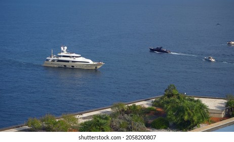 Aerial View Of The Famous City On The Mediterranean Sea Luxury Yacht Moored In The Bay, Marina Port, Yacht Club. Panorama Of The European Landscape From Above MONTE CARLO, MONACO SEPTEMBER 2021 