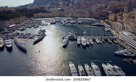 Aerial View Of The Famous City On The Mediterranean Sea Luxury Yacht Moored In The Bay, Marina Port, Yacht Club. Panorama Of The European Landscape From Above MONTE CARLO, MONACO SEPTEMBER 2021 