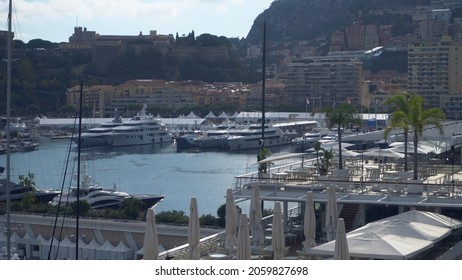 Aerial View Of The Famous City On The Mediterranean Sea Luxury Yacht Moored In The Bay, Marina Port, Yacht Club. Panorama Of The European Landscape From Above MONTE CARLO, MONACO SEPTEMBER 2021 