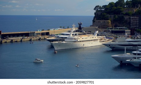 Aerial View Of The Famous City On The Mediterranean Sea Luxury Yacht Moored In The Bay, Marina Port, Yacht Club. Panorama Of The European Landscape From Above MONTE CARLO, MONACO SEPTEMBER 2021 