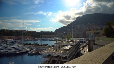 Aerial View Of The Famous City On The Mediterranean Sea Luxury Yacht Moored In The Bay, Marina Port, Yacht Club. Panorama Of The European Landscape From Above MONTE CARLO, MONACO SEPTEMBER 2021 