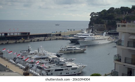 Aerial View Of The Famous City On The Mediterranean Sea Luxury Yacht Moored In The Bay, Marina Port, Yacht Club. Panorama Of The European Landscape From Above MONTE CARLO, MONACO SEPTEMBER 2021 