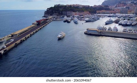 Aerial View Of The Famous City On The Mediterranean Sea Luxury Yacht Moored In The Bay, Marina Port, Yacht Club. Panorama Of The European Landscape From Above MONTE CARLO, MONACO SEPTEMBER 2021 