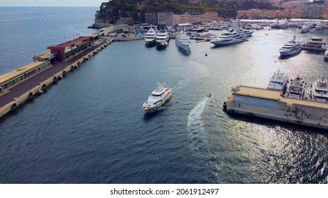 Aerial View Of The Famous City On The Mediterranean Sea Luxury Yacht Moored In The Bay, Marina Port, Yacht Club. Panorama Of The European Landscape From Above MONTE CARLO, MONACO SEPTEMBER 2021 