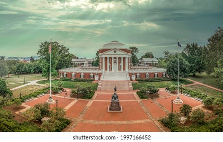 Aerial view of the famous Rotunda building of the University of Virginia in Charlottesville with classic Greek arches design by President Jefferson iconic building of the campus with dramatic sunrays