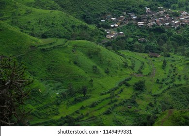 Aerial View Of Farm Field Plots Pattern, Lush Green Monsoon Nature Landscape Mountains, Hills, Purandar, Pune, Maharashtra, India 