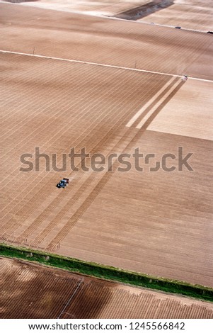 Similar – Erntemaschine, die im Feld arbeitet. Kombinierte Maschine