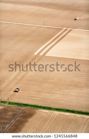 Similar – Erntemaschine, die im Feld arbeitet. Kombinierte Maschine