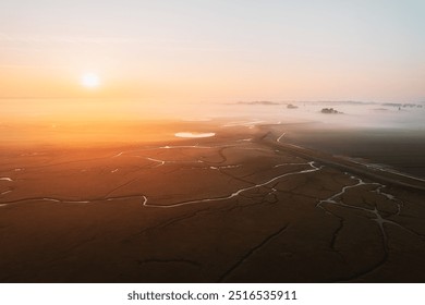 Aerial view of the farmland, meadow and river with fog at Sunrise  - Powered by Shutterstock