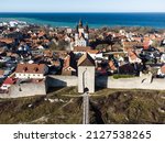 Aerial view of fhe  Dalmansporten, or Dalman gate, along the medieval city wall of Visby in the Gotland island in Swedeon on a sunny winter day
