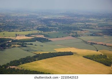 The aerial view of the fields and cousy settlements located in the lowlands surrounding county and university town of Cambridge. Cambridgeshire. United Kingdom - Shutterstock ID 2210542513
