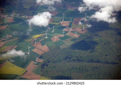 Aerial view of fields with wind turbines 