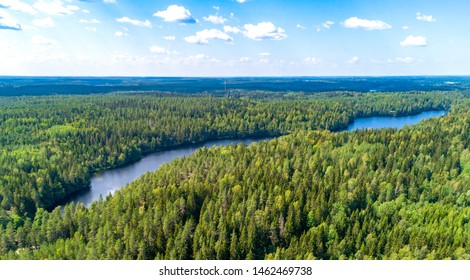 Aerial View Of Finland. Pine Forest And Blue Lake In Finland.