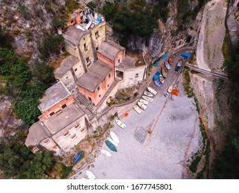 Aerial View Of Fiordo Di Furore Beach. Traditional Building In The South Of Italy. Stone Houses In The Gorge Of The Mountains. Hard To Reach Place. Sunny Summer Day.