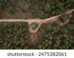 Aerial view of a fire watch tower for forest guards between mountains in northern Castilla y Leon, Spain.