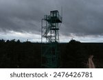 Aerial view of a fire watch tower for forest guards between mountains in northern Castilla y Leon, Spain.