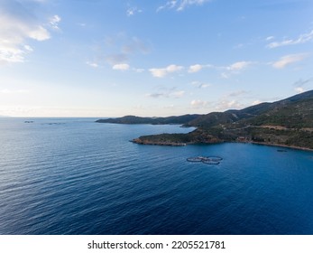 Aerial View Of A Fish Farms At The Coast Of Aegean Sea. Circle Fish Farming Industry