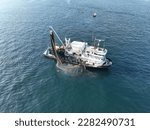 Aerial view of fishing ship. Aerial view of fishermen hunting