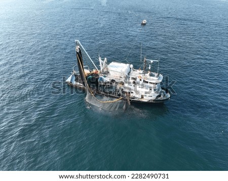Aerial view of fishing ship. Aerial view of fishermen hunting