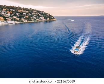 Aerial View Of Fishing Trawler Coming Back To The Harbour. Beautiful Landscape With Two Boats Visible.