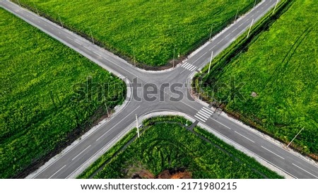  Aerial view of a flat automobile intersection. Static video. A flat road with markings. View from the height of the highway