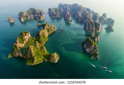 Aerial view floating fishing village and rock island, Halong Bay, Vietnam, Southeast Asia. UNESCO World Heritage Site. Junk boat cruise to Ha Long Bay. Popular landmark, famous destination of Vietnam - Shutterstock ID 1218764578