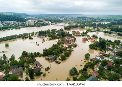 Aerial view of flooded houses with dirty water of Dnister river in Halych town, western Ukraine. - Shutterstock ID 1764130496