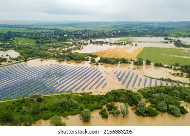 Aerial View Of Flooded Solar Power Station With Dirty River Water In Rain Season.