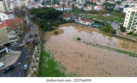 Aerial view from a floods, due to the river overflowing flooding houses and roads at Estoril,Cascais,Portugal - Shutterstock ID 2237564039