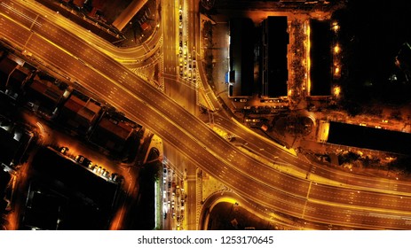 Aerial view of fly over roads. The lamp post street light colour in gold.