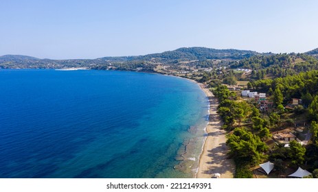 Aerial View From Flying Drone Of People Crowd Relaxing On Beach In Greece.