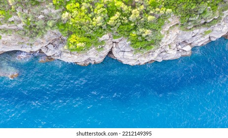 Aerial View From Flying Drone Of People Crowd Relaxing On Beach In Greece.